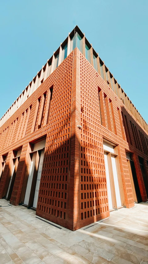 a brick building on the corner of a walkway