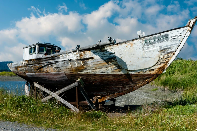 old, dilapidated fishing boat on the shore