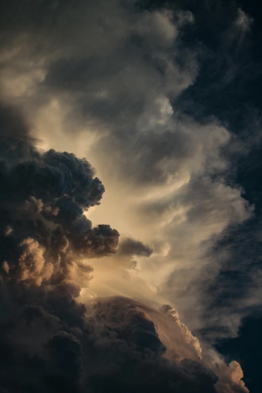 clouds moving in with sun rays peeking through