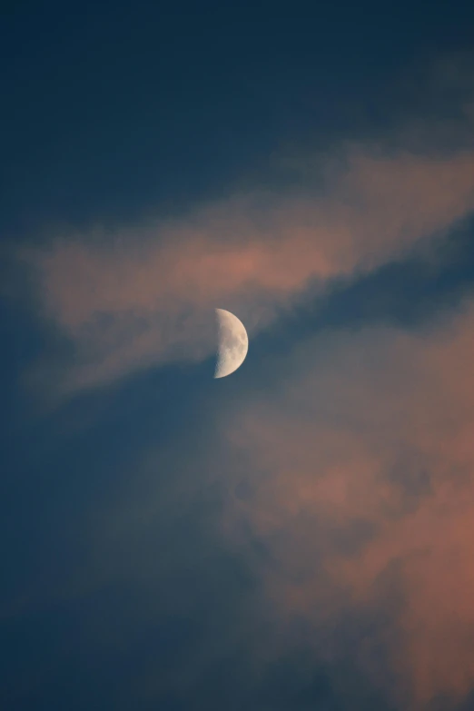 a view of a moon and some clouds