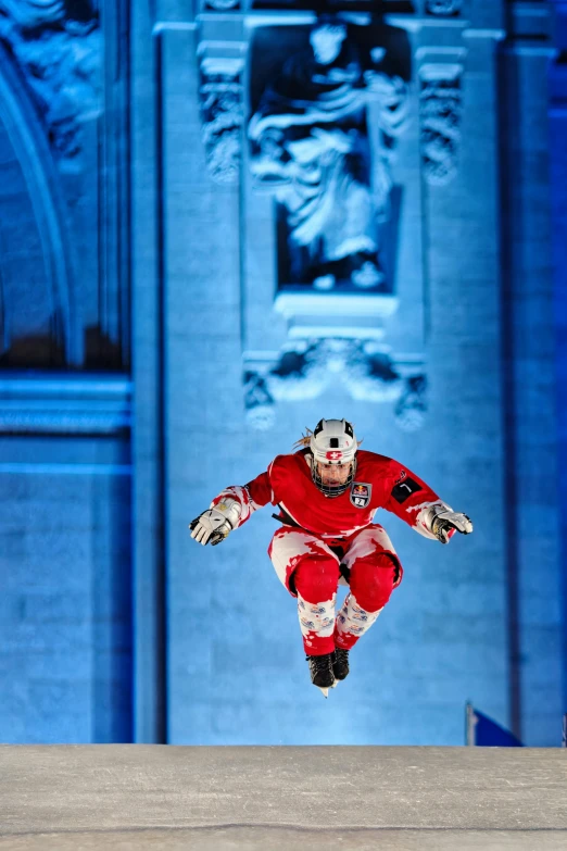 a male skateboarder is in mid air doing a trick