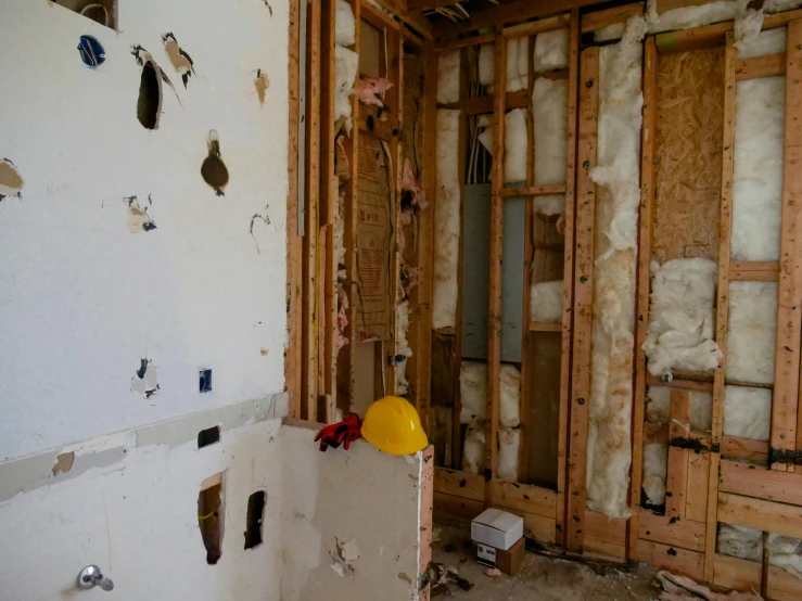 a room that is being remodeled and has wooden walls in it