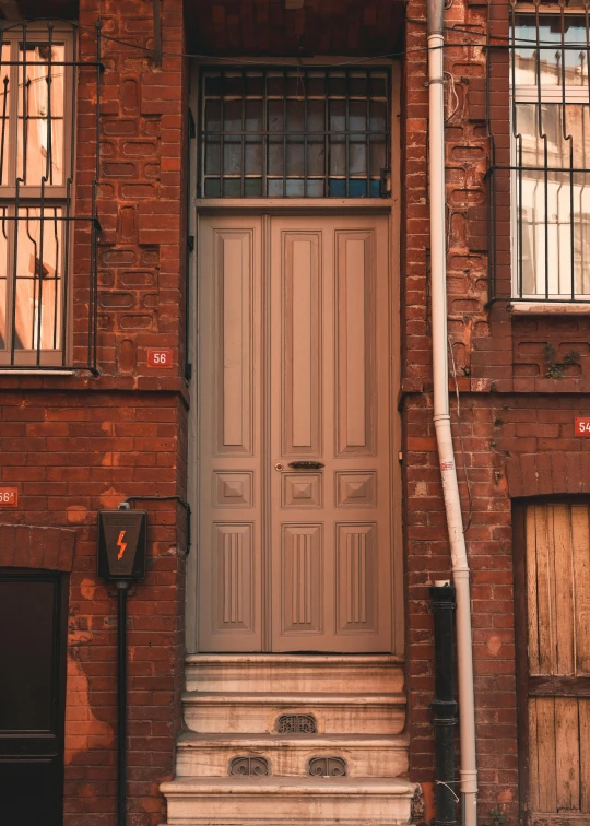 a door on a house has the number 511 engraved
