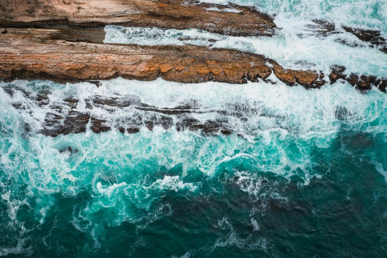 the coast is covered in rough blue water