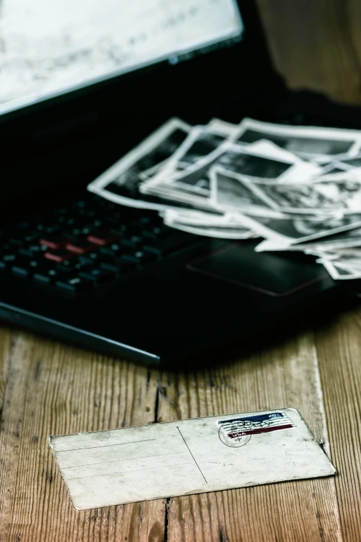 a desk with a laptop and several stickers