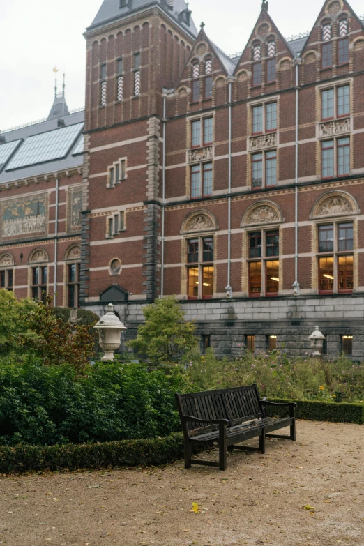 the old building has a long wall made of red bricks