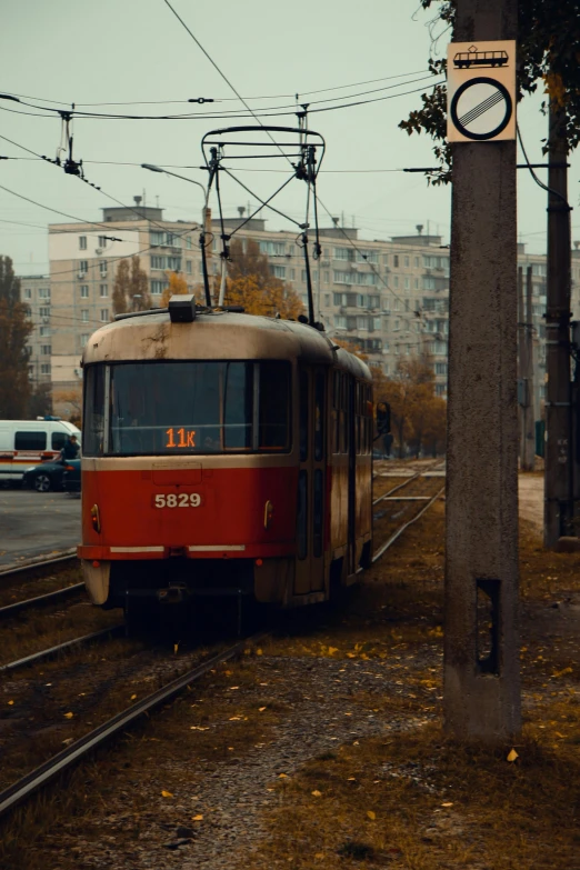 a passenger trolley in the city with many traffic