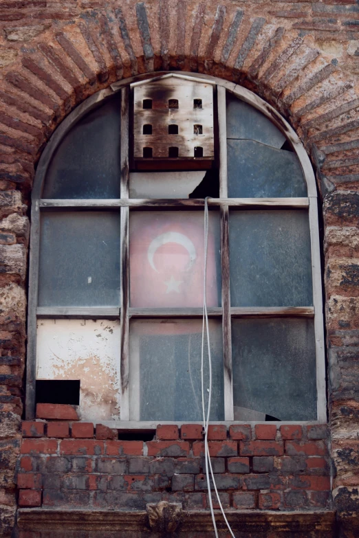 a view through the window of an old brick building