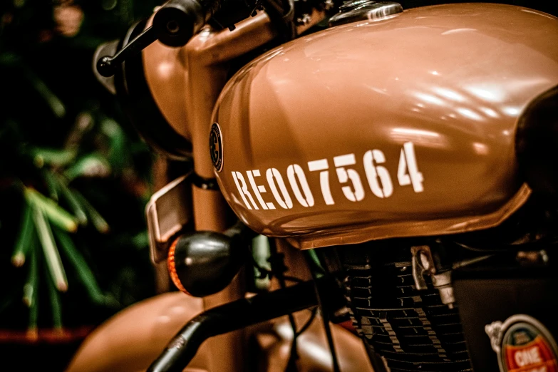 a close up of the front of a brown motorcycle