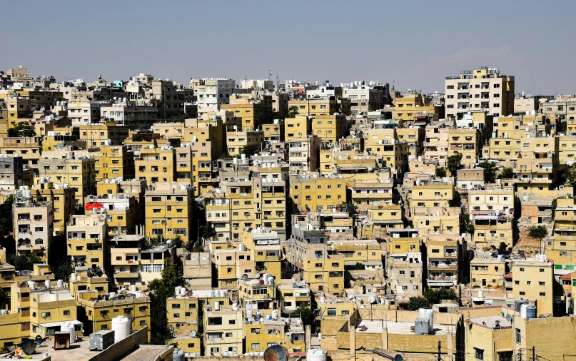 the top of a city in the desert, with many buildings and balconies on the roof