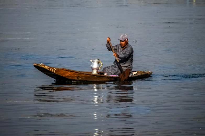 an indian fisherman is about to bring his catch