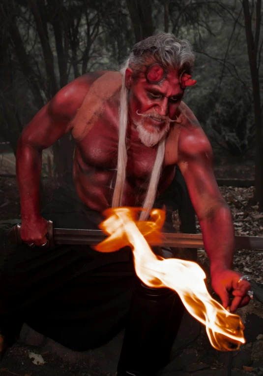 a man in red is being used to make a fire effect