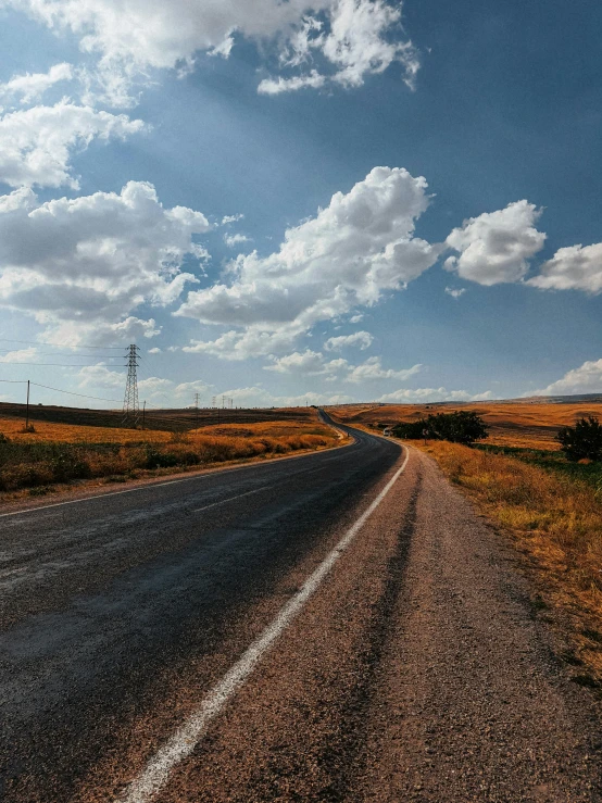 a lonely country road with no cars driving on it