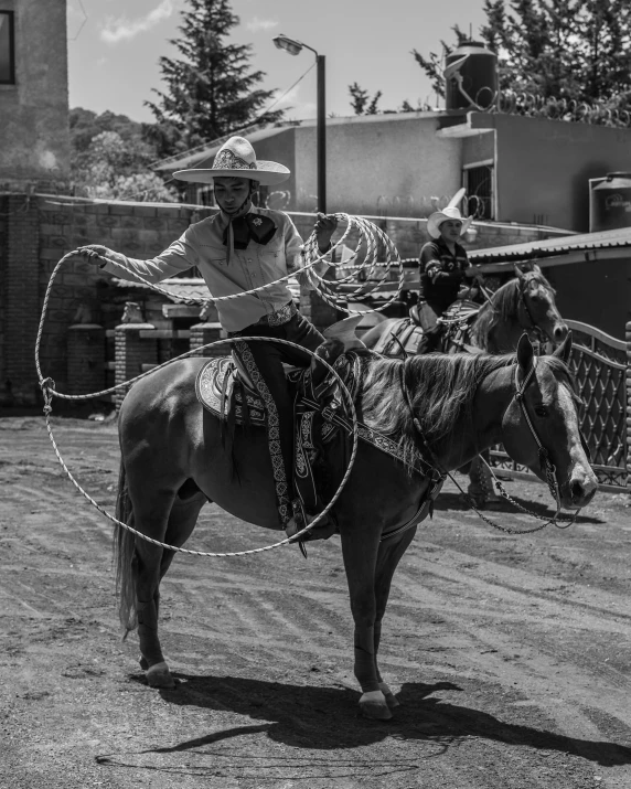 a man riding a horse in an outdoor area