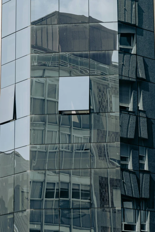 the reflection of a building through a glass door