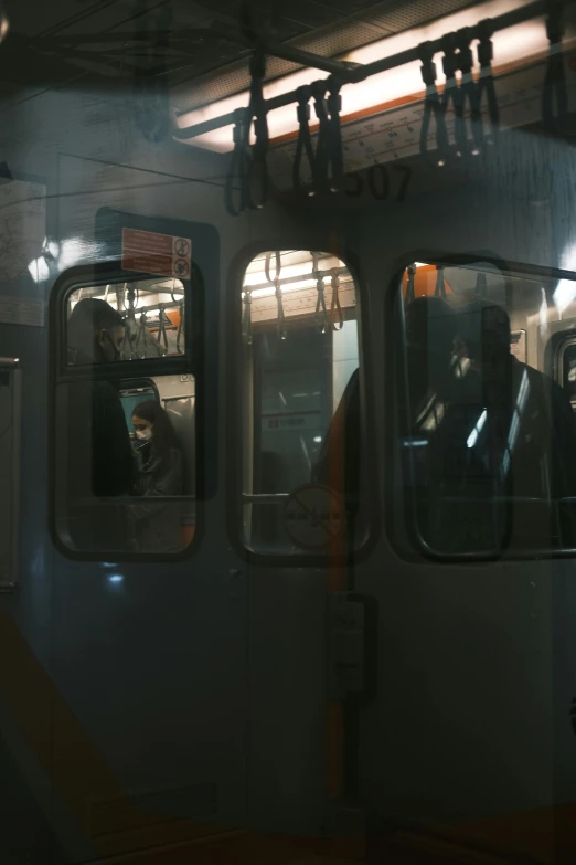 a bus filled with passengers sitting in a stationary position