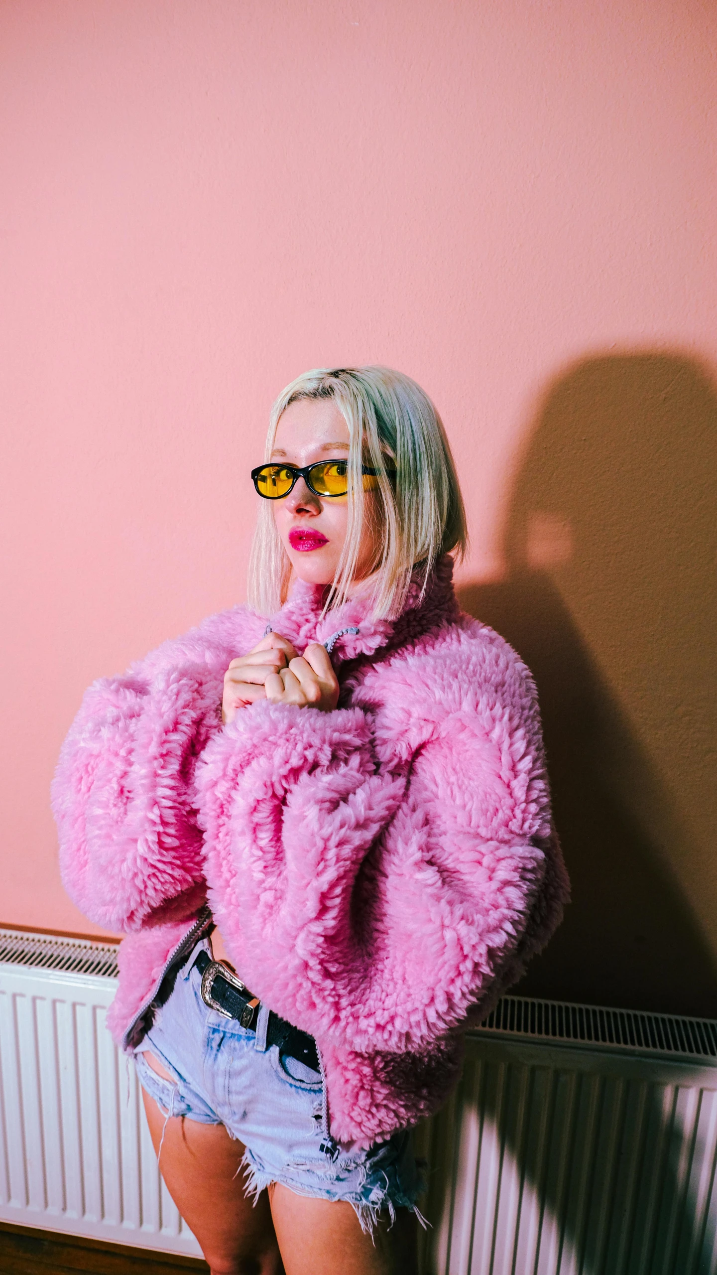 a girl with pink fur and shorts