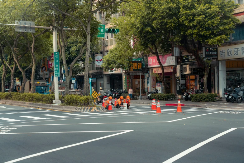 a road is closed for traffic with people standing in it