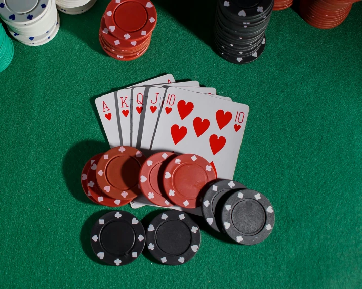 poker cards and chips on green felt