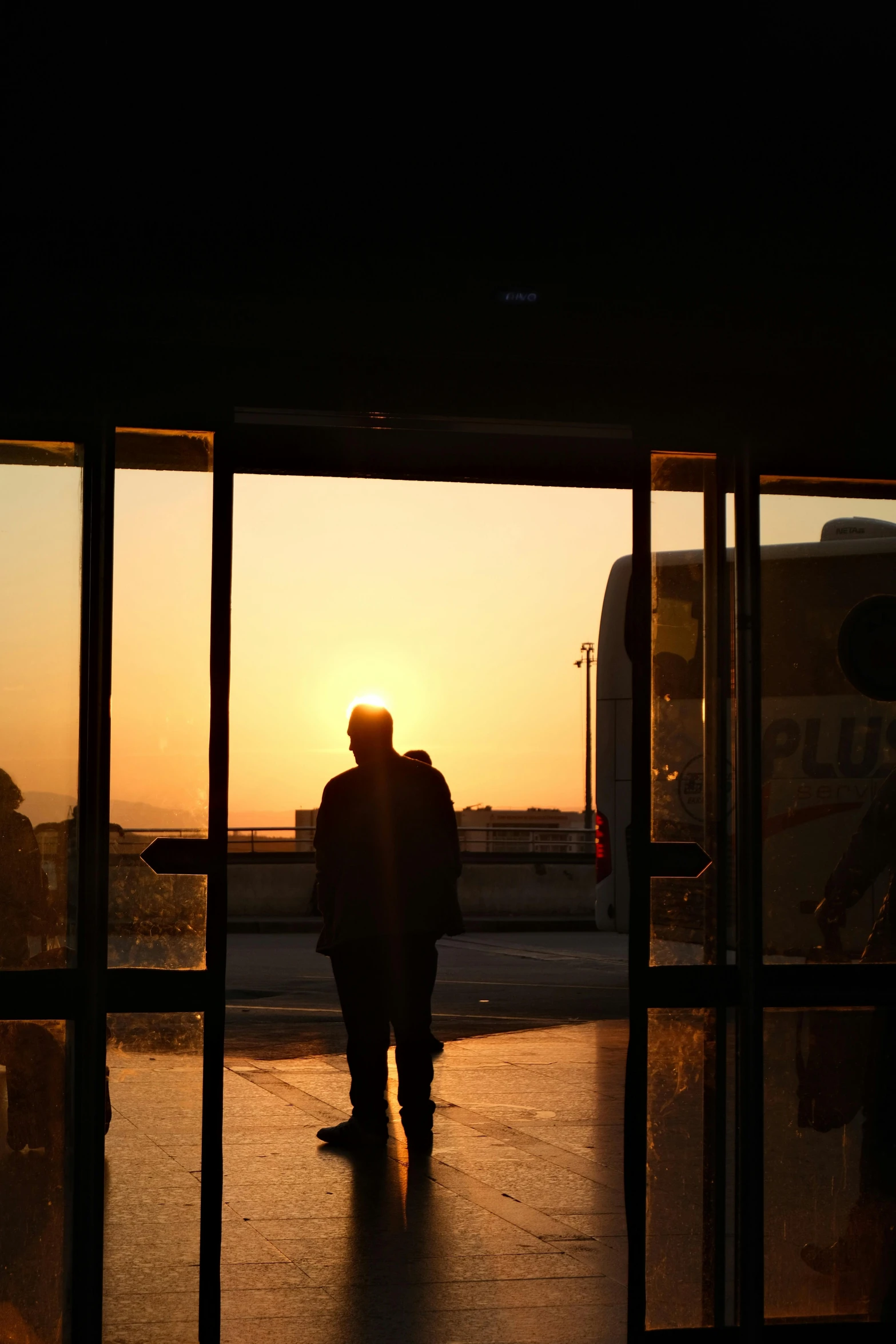 there is a man walking out of an airport