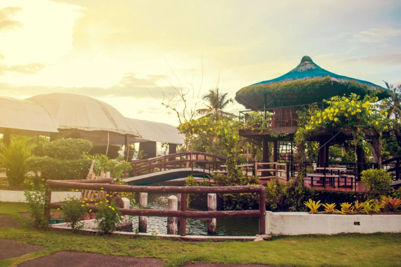 a scenic view of a resort, with small water gardens in the background