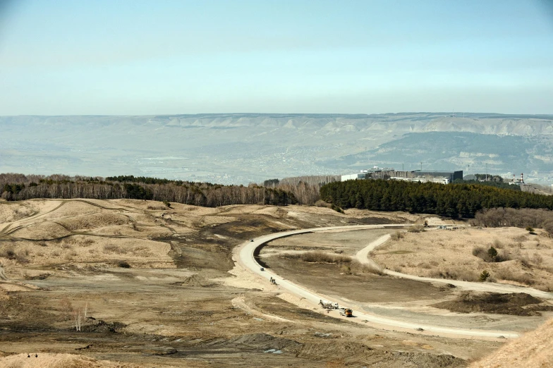 an aerial view shows the road leading to a large area