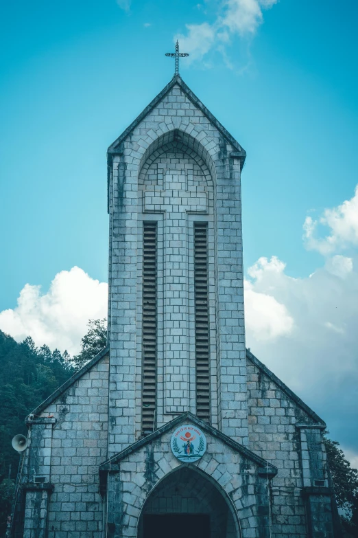 a white church with a clock on the front and steeple