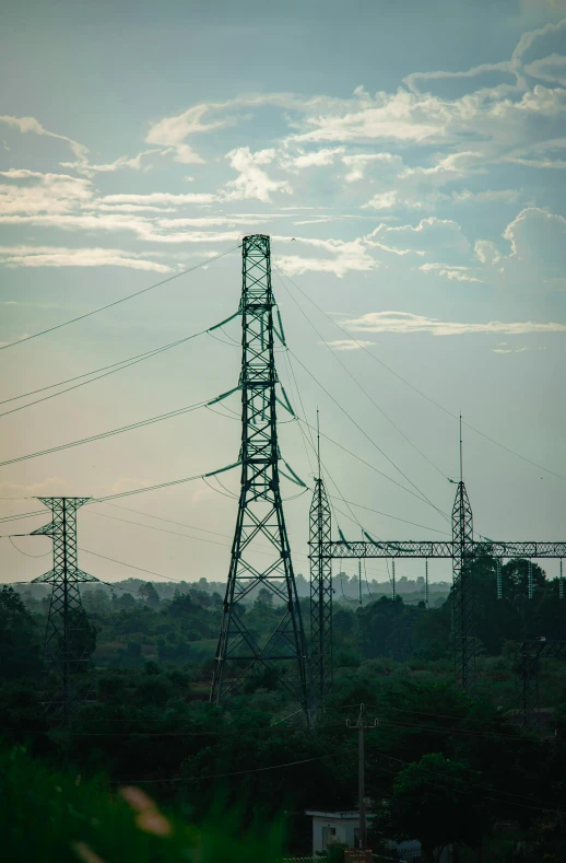 power lines line up against the sky with many wires