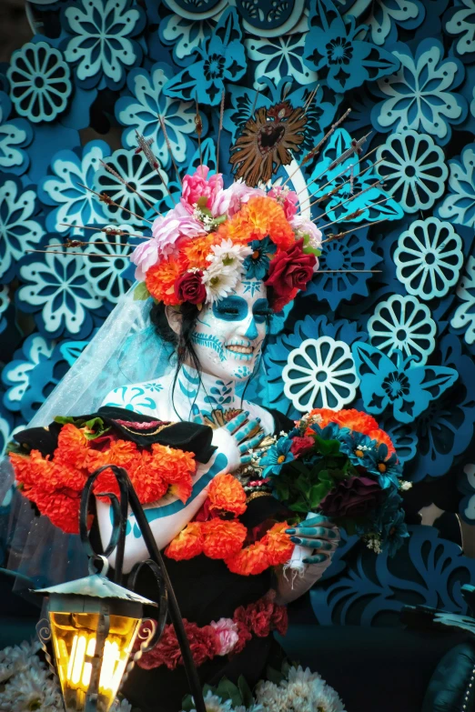 a person dressed in mexican clothing with a white mask