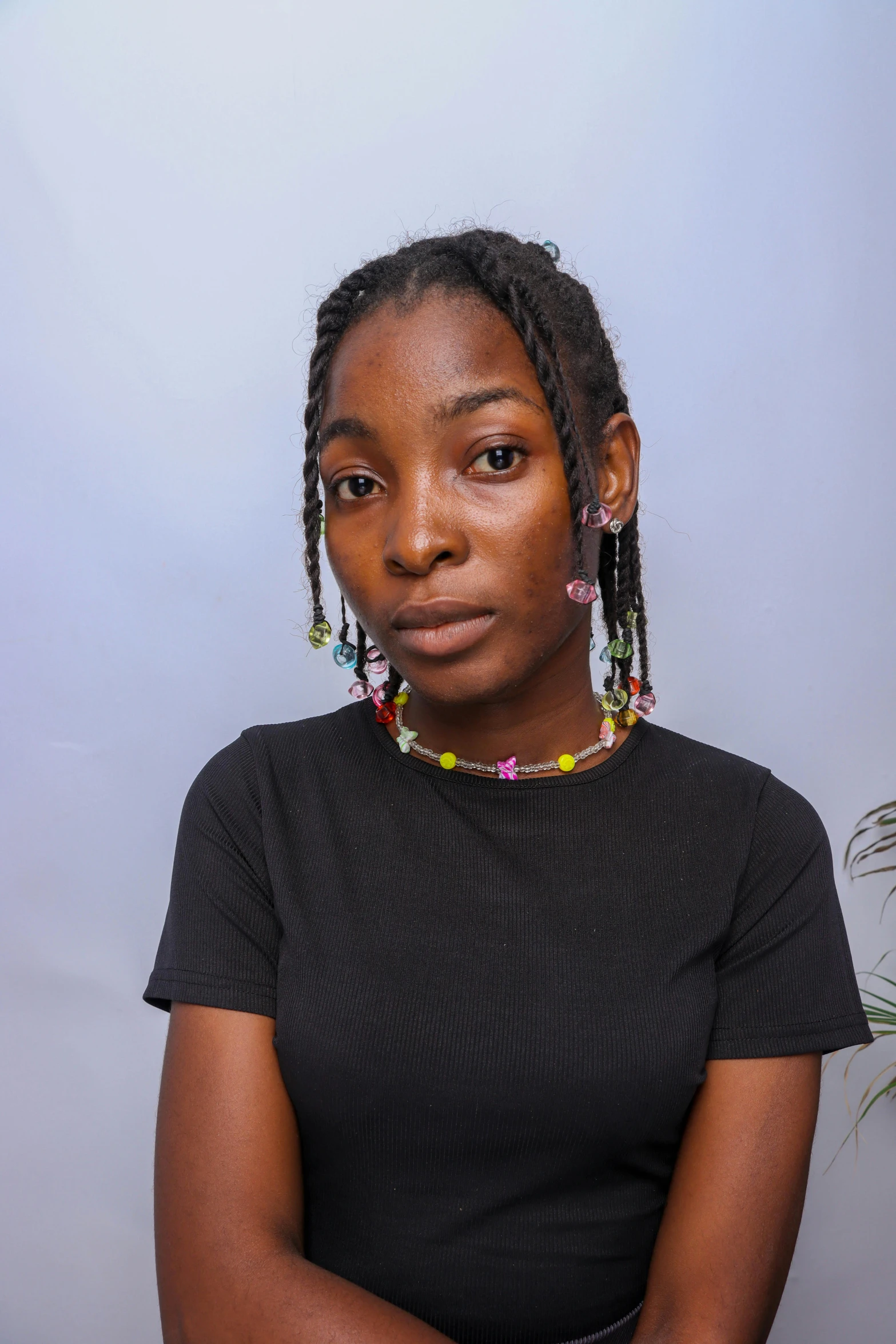 young black woman posing with a bunch of earrings