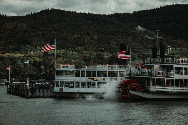 the river is full of steamboat boats as smoke pours out