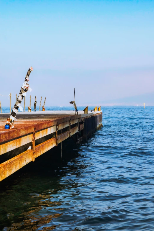 an image of a dock that is in the middle of the water