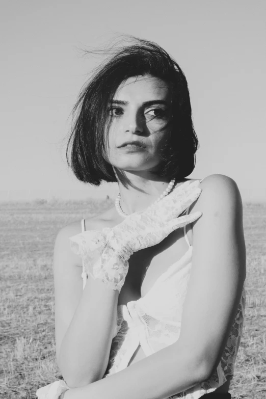 black and white pograph of a woman wearing a dress