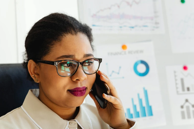 an african american business woman talking on the phone