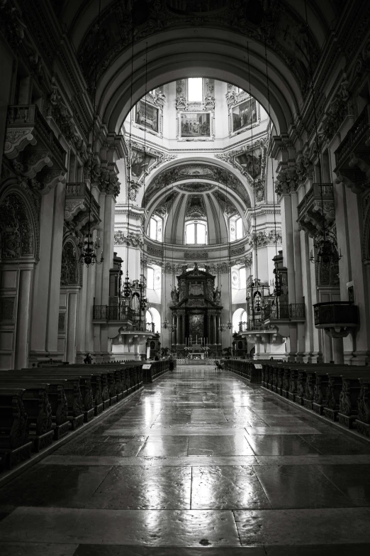 an ornate looking cathedral with pillars, windows and vaulted ceiling