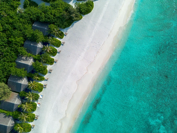 an aerial s of a white sand beach