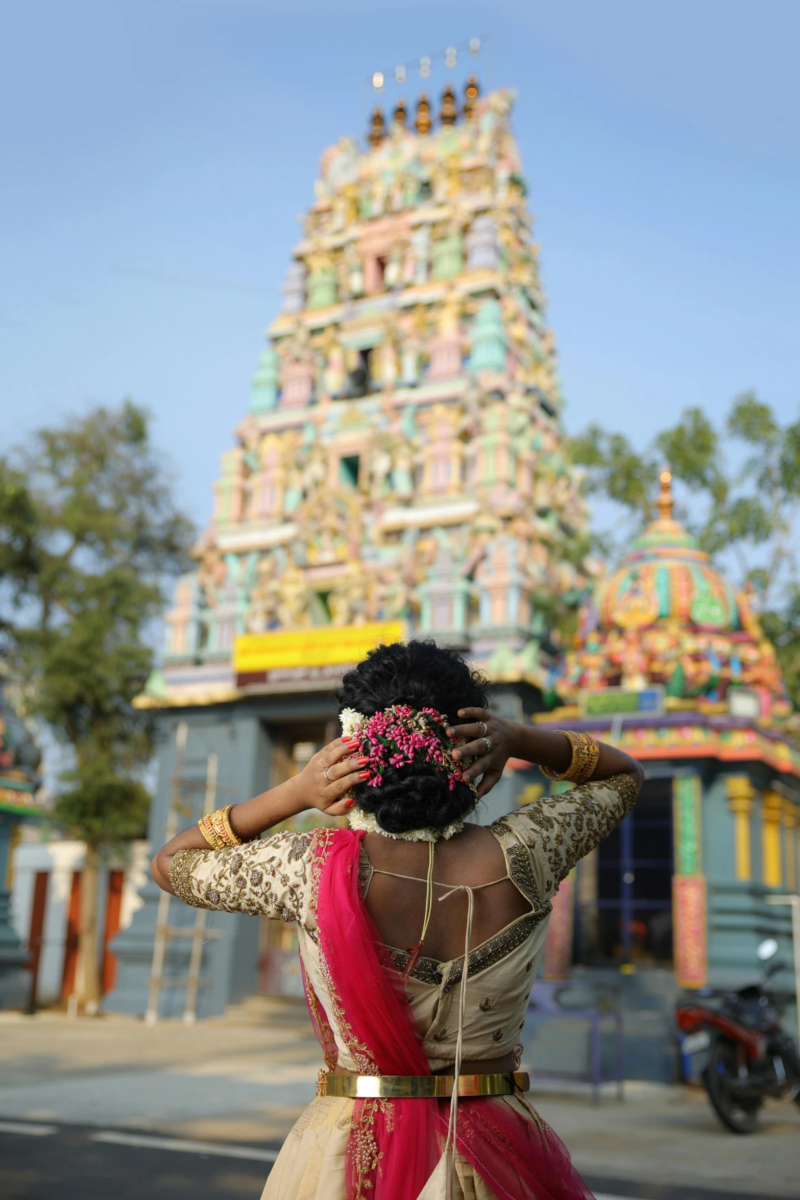 a woman in traditional dress posing for the camera