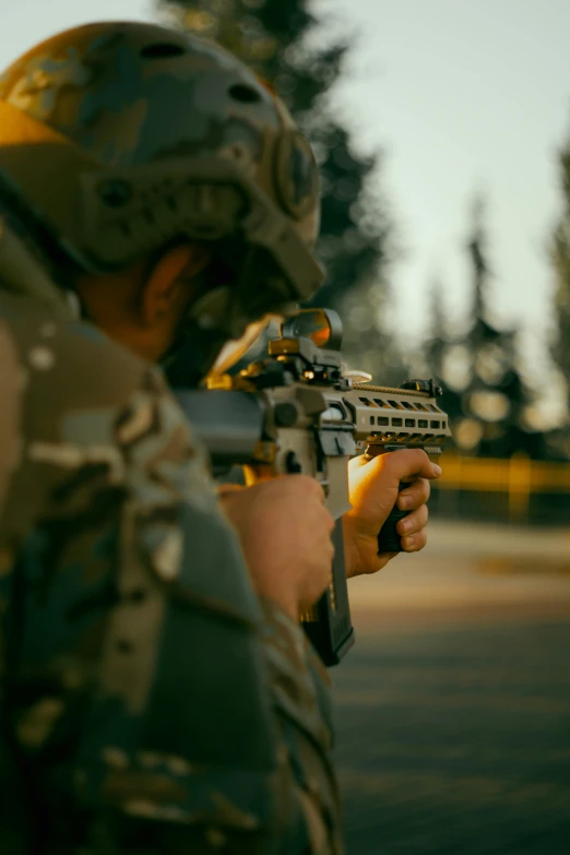 a soldier aims his weapon at the camera