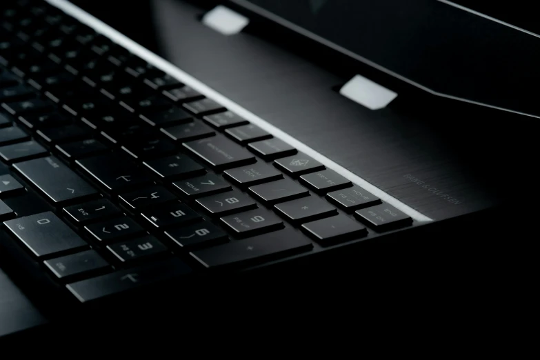 a dark po of a computer keyboard and mouse