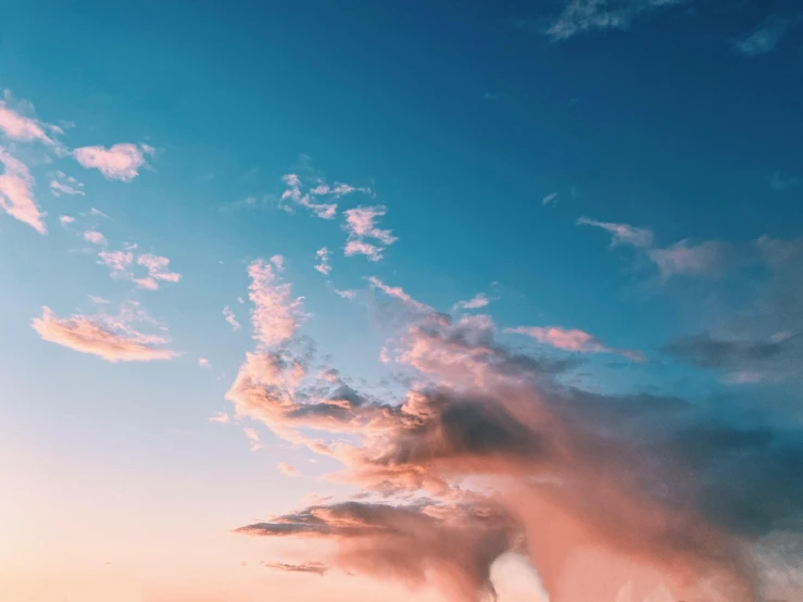 large dust plume in front of some blue sky