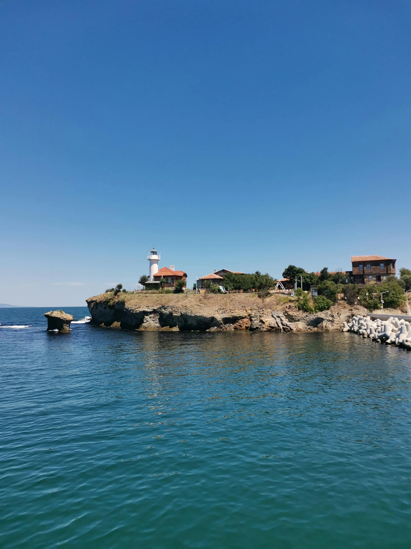 a view of a body of water and a lighthouse