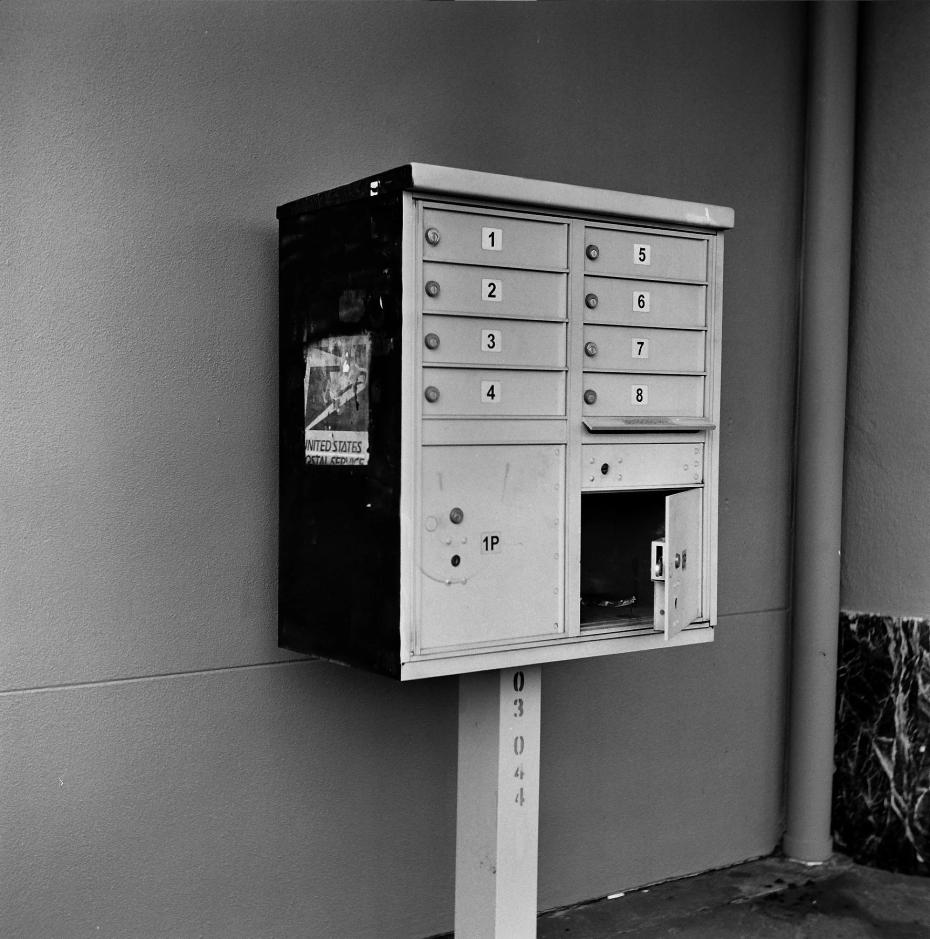 a mailbox near the entrance to a building