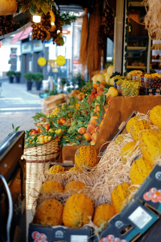 a display in the street with fruits and vegetables