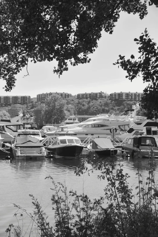 many boats parked at docks in a harbor