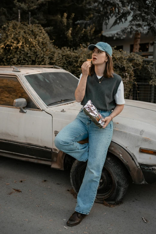 an image of a woman eating soing in the street