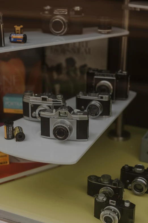 a small display case that has a number of cameras