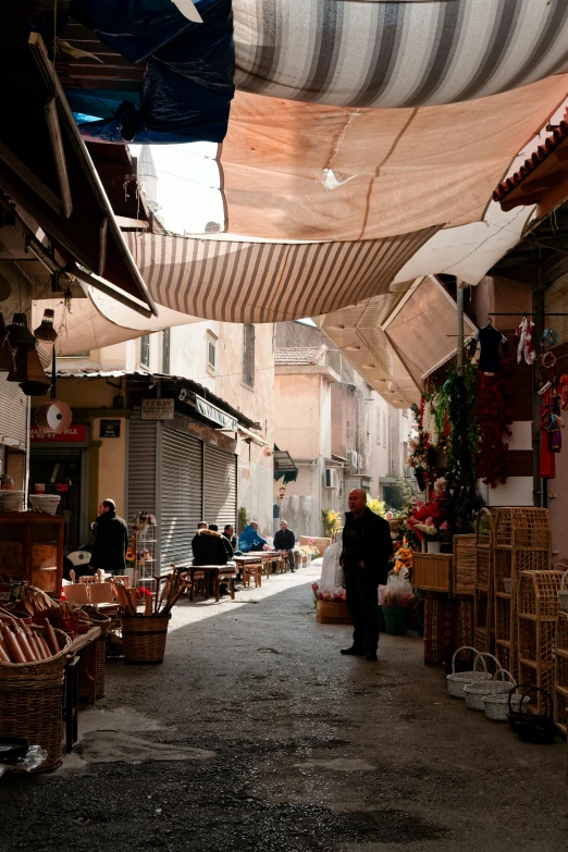 there are many hanging and stacked items on this street