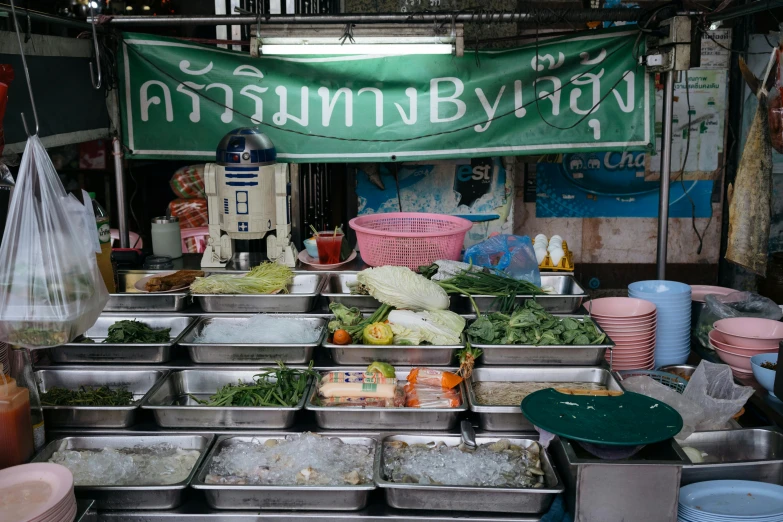 a bunch of food that is in front of some signs