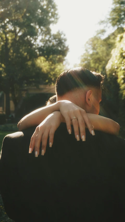 two people emcing each other on their back