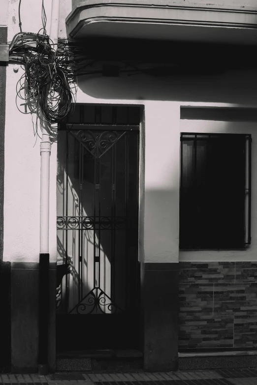 a black and white po of a doorway and building